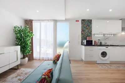 a living room with a couch and a kitchen at Studio Casa Belavista in Gaula