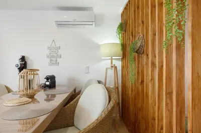 a dining room with a table and a wooden wall at Studio Casa Belavista in Gaula