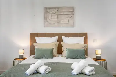 a bedroom with a large bed with towels on it at Studio Casa Belavista in Gaula