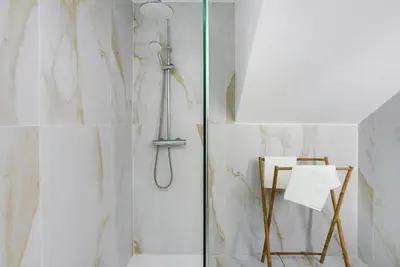 a shower with a glass door in a bathroom at Studio Casa Belavista in Gaula