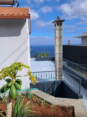 a terrace with a lighthouse on the roof of a house at House Virginia in Santa Cruz