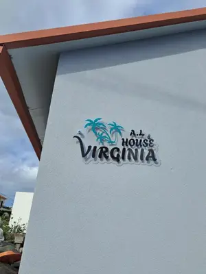 a sign on the side of a building at House Virginia in Santa Cruz