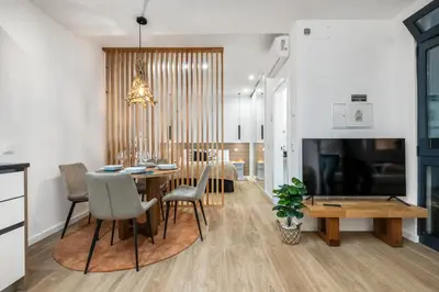a kitchen and dining room with a table and chairs at The SPOT in Funchal