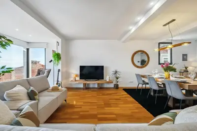 a living room with a couch and a table at The SPOT in Funchal
