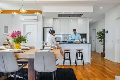two people standing in the kitchen of a house at The SPOT in Funchal