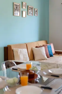 a living room with a couch and a glass table at Porto Santo Beach & Golf Apartment - Sun Refuge in Porto Santo