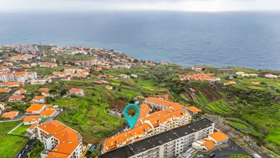 an aerial view of a resort near the ocean at Ti Clara in Caniço
