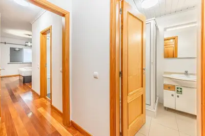 a bathroom with a toilet and a sink at Ti Clara in Caniço