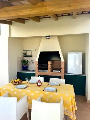 a dining room with a yellow table and chairs at Sea View Suite with Balcony and Pool - Praia da Luz in Luz