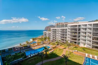 an aerial view of a hotel and the ocean at Suite 107 in Funchal