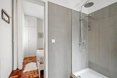 a bathroom with a shower with a glass door at Live, Love and Laugh in Funchal