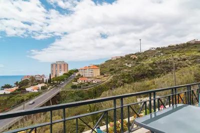 a balcony with a view of the ocean at GuestReady - Caniço paradise with ocean view in Santa Cruz
