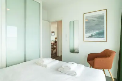 a bedroom with a bed with two towels on it at GuestReady - Endless Ocean Views in Santa Cruz