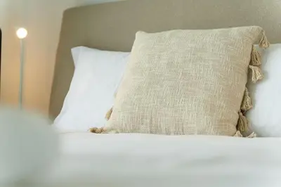 a bed with a pillow on top of it at GuestReady - Endless Ocean Views in Santa Cruz