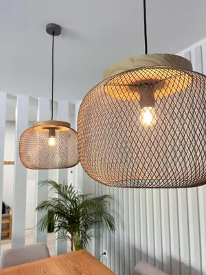 two lights hanging over a dining room table at New 3 Bedroom Luxury Family Apartment - Airco, King Size Beds, Fully equipped kitchen, Balcony, Washingmachine, 2 bathrooms, Free parking, Fast Internet, 142m2 in Machico