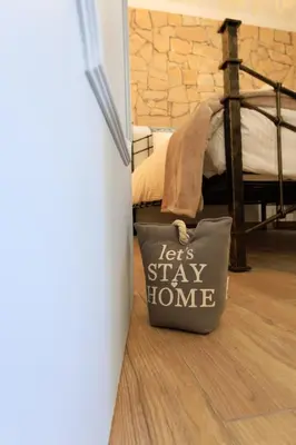 a bag sitting on the floor next to a bedroom at Casinha da Raposeira in Raposeira