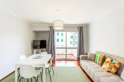 a living room with a couch and a table at JMF Apartment in Funchal