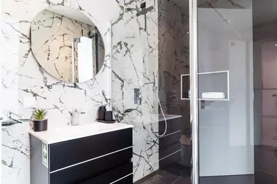 a bathroom with a sink and a mirror at GuestReady - Sunset Heaven Villa in Calheta