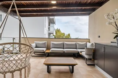 a living room with a couch and a swing at Casa das Raposinhas IV, Funchal in Funchal