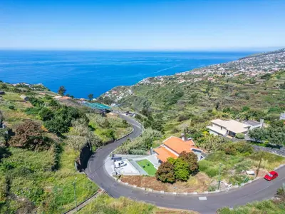 an aerial view of a road and the ocean at Ocean SkyLine in Arco da Calheta