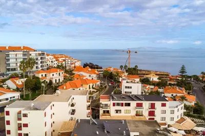 an aerial view of a city with buildings and the ocean at R&V Paradise by GALMI in Santa Cruz