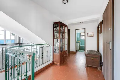 a staircase in a house with a stair case at Luz Home - Three Bedroom Villa in Luz