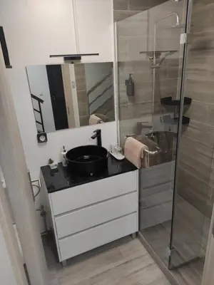 a bathroom with a sink and a shower at Little Hideaway in São Vicente