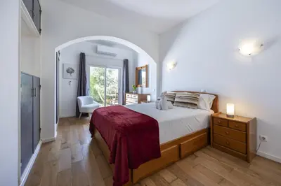 a bedroom with a bed and a desk and a chair at Beach Lovers Duplex & Studio by Seewest in Lagos