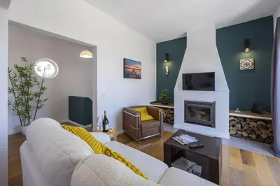a living room with a couch and a fireplace at Beach Lovers Duplex & Studio by Seewest in Lagos