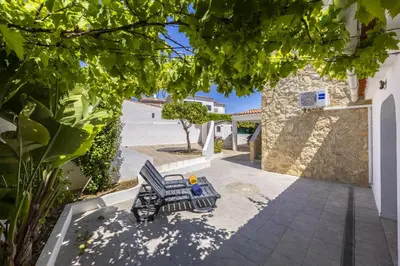 a patio with a couple of chairs and a table at Beach Lovers Duplex & Studio by Seewest in Lagos