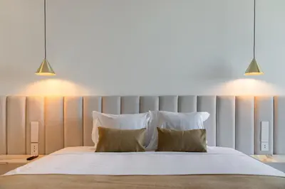 a bedroom with a large bed with two pillows at Lyra Lux Penthouse by LovelyStay in Funchal