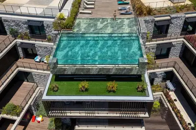 an overhead view of a building with a swimming pool at Lyra Lux Penthouse by LovelyStay in Funchal