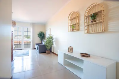 a living room with white walls and a white counter at Casa das Lajes by LovelyStay in Gaula