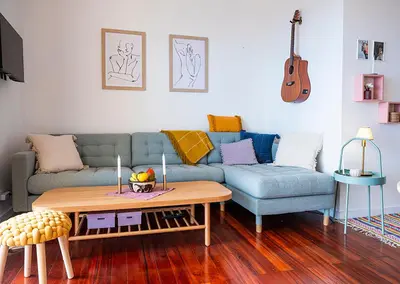 a living room with a couch and a table at Apartment São Martinho - Caniço in Caniço