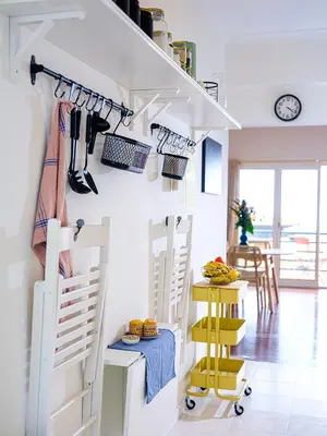a room with a white staircase with yellow accents at Apartment São Martinho - Caniço in Caniço