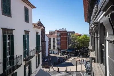 a view of a street in a city with buildings at Zarco Suites by Sé Funchal in Funchal