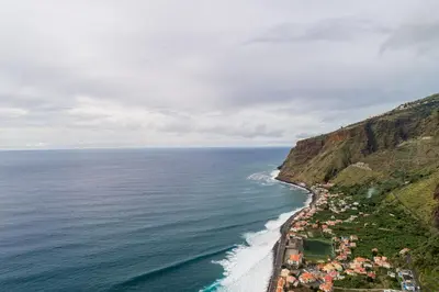 an aerial view of the ocean and a beach at Casa Carreiro in Paul do Mar