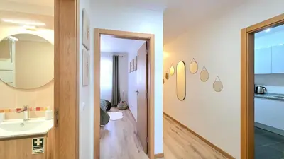 a bathroom with a sink and a mirror at Casa Dama Ana in Caniço
