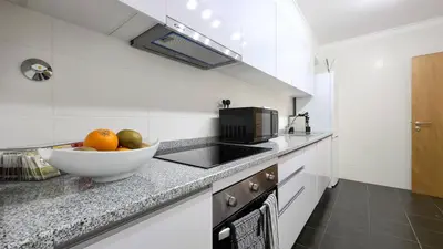a kitchen with a bowl of fruit on a counter at Casa Dama Ana in Caniço