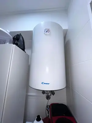 a white lamp in a corner next to a refrigerator at Casa Dama Ana in Caniço