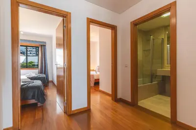 a room with a glass door leading to a bathroom at Views of Madeira by Atlantic Holiday in Ilhéu do Gorgulho