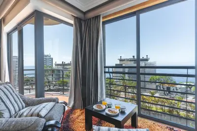 a living room with a view of the ocean at Views of Madeira by Atlantic Holiday in Ilhéu do Gorgulho