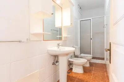 a white bathroom with a sink and a toilet at Villa Santa Luzia 1 by Atlantic Holiday in Santa Luzia