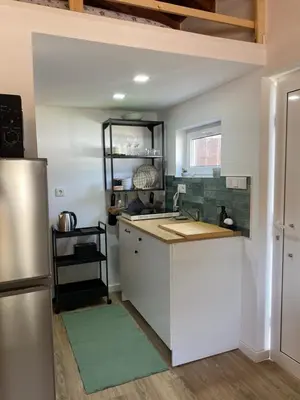 a kitchen with a sink and a refrigerator at Casa Vinny in Aljezur