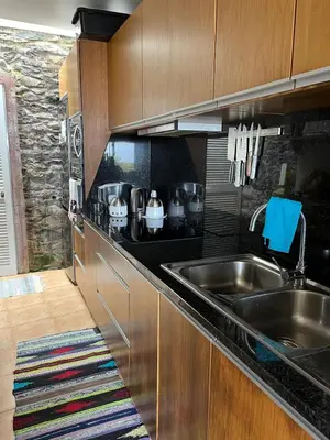 a kitchen with a sink and a counter top at Casa Maria in Ribeira Brava