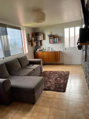 a living room with a couch and a table at Casa Maria in Ribeira Brava