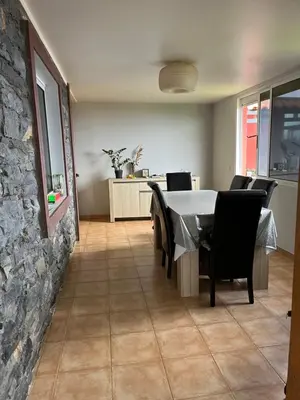 a dining room with a table and chairs at Casa Maria in Ribeira Brava