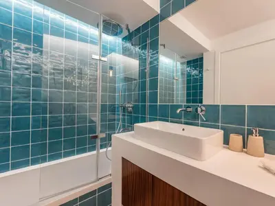 a bathroom with a sink and a mirror at Casa N.º 1 in Luz