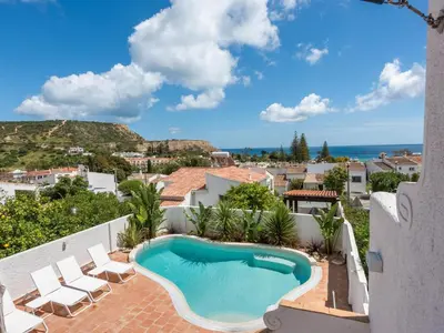 a swimming pool on the balcony of a house with a view at Casa N.º 1 in Luz