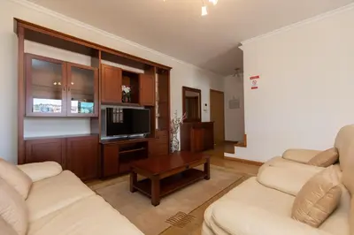 a living room with two couches and a tv at Anadia Penthouse Duplex by Rent-a-key in Funchal
